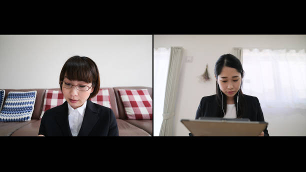 istock Two businesswomen talking on web conference at home 1249729353