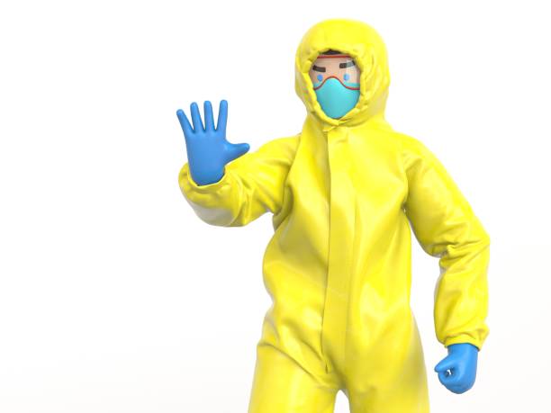 istock Medic in yellow hazmat suit raise hand, stop sign 1249731241