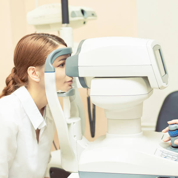 istock Eye ophthalmologist exam. Eyesight recovery. Astigmatism check concept. Ophthalmology diagmostic device. Beauty girl portrait in clinic 1249732829