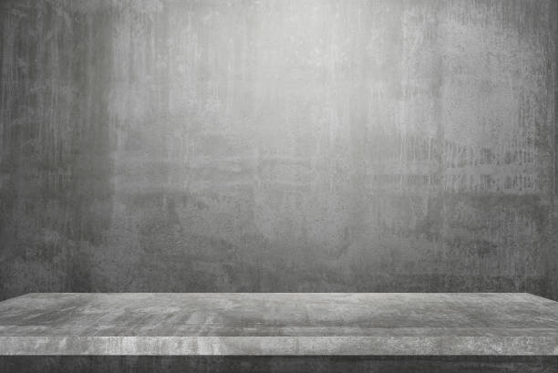 istock empty table top Ready for product display montage; cement table and gray cement background. 1249732873