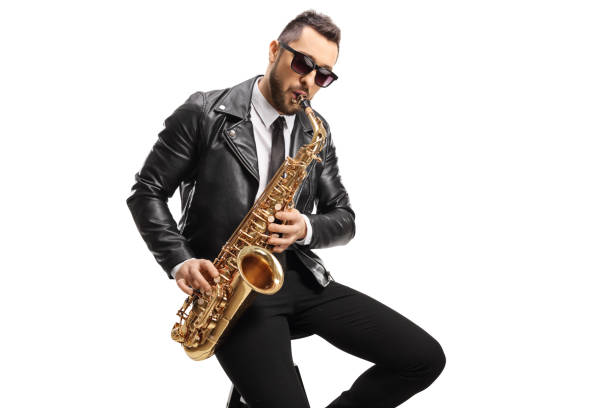 istock Male musician in a leather jacket sitting and playing a saxophone 1249734210