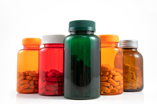 Close-up shot of colorful pill bottles