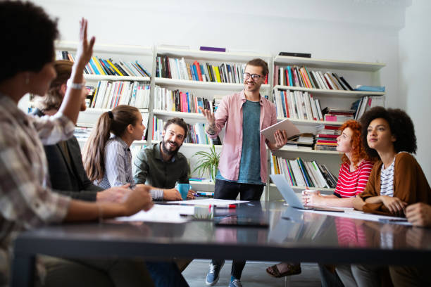 istock Business people, architects having discussion and working in office 1249734999