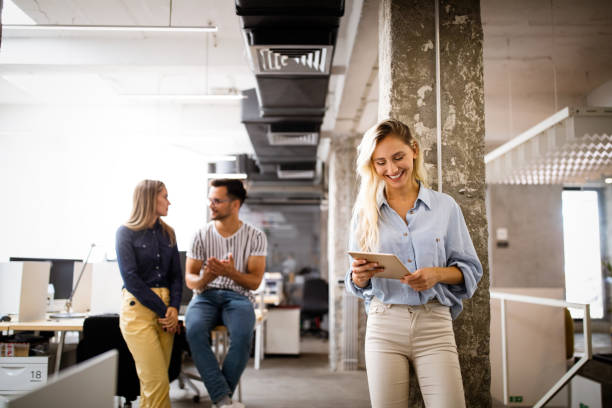 istock Successful company with happy employees in modern office 1249736601