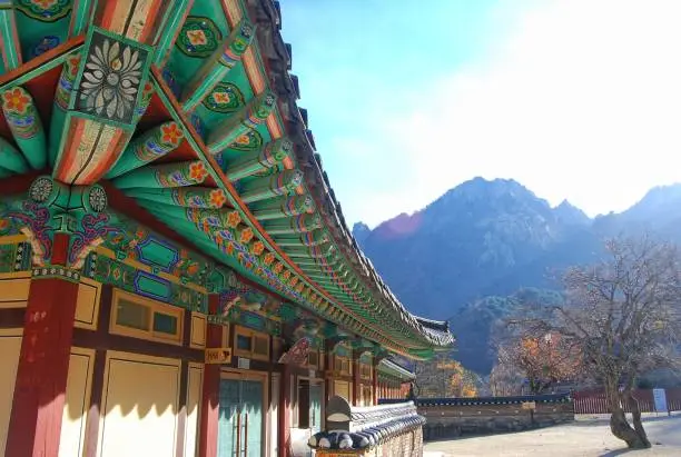 Sokcho, South Korea - November 12, 2014 : Buddhist Architecture of Sinheungsa Temple with Mountain Background in Seoraksan National Park.