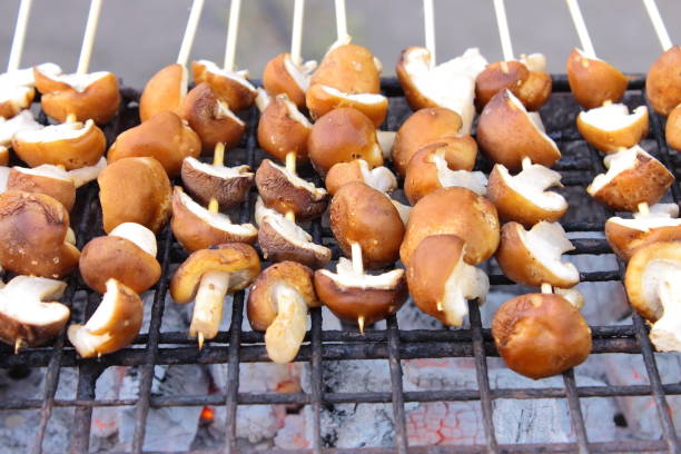 Grilled black mushroom for food and sale stock photo