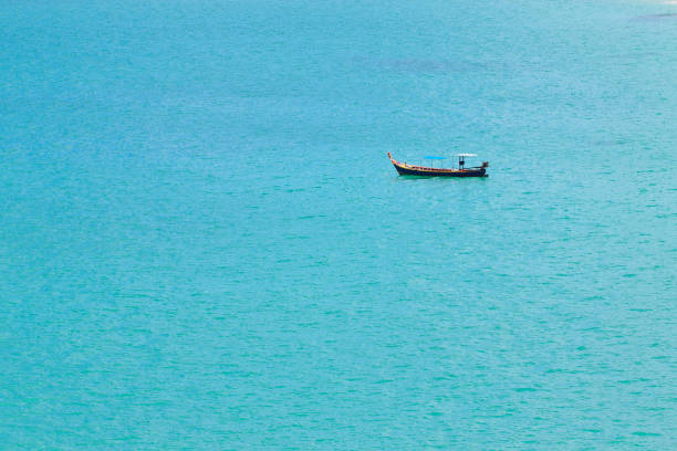 Sea and fishing boat stock photo