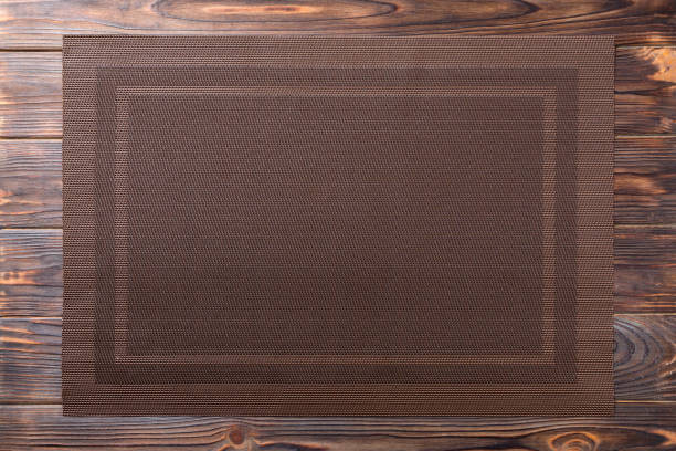 istock Top view of empty brown tablecloth on wooden background with copy space 1249740540