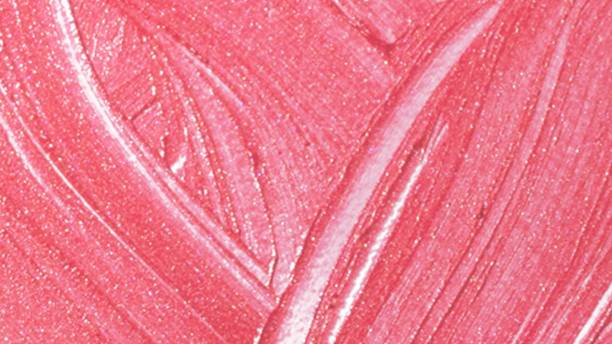 istock Beautiful pink liquid lipstick marks background 1249740987
