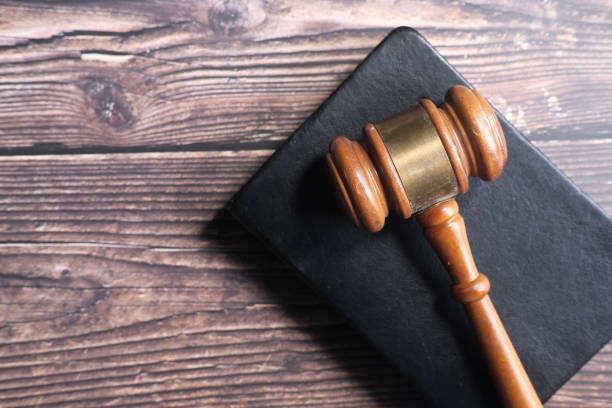 istock Top view of gavel on a book on table 1249742296