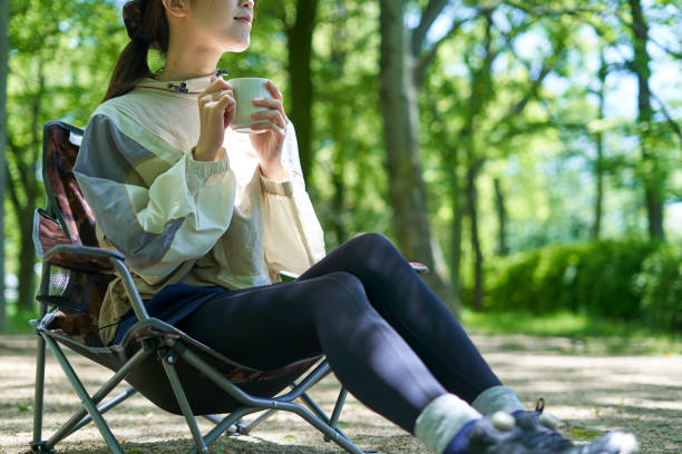 A young Japanese woman enjoying a camp alone