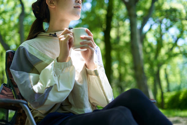 istock A young Japanese woman enjoying a camp alone 1249742344