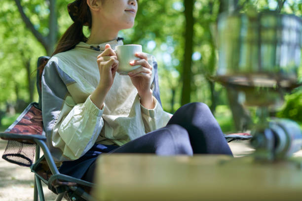 istock A young Japanese woman enjoying a camp alone 1249742358