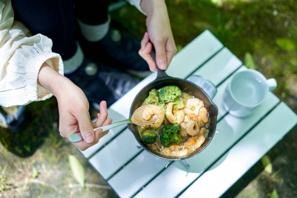 istock A young Japanese woman enjoying a camp alone 1249742419
