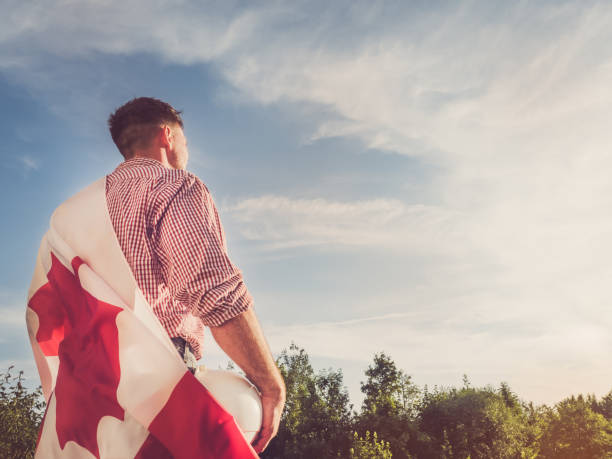 istock Young engineer, white hardhat and Canadian Flag 1249743846