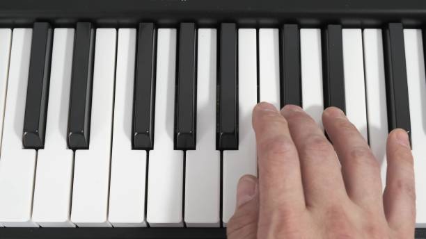 istock The pianist, hand playing a piano. Music. 1249743856