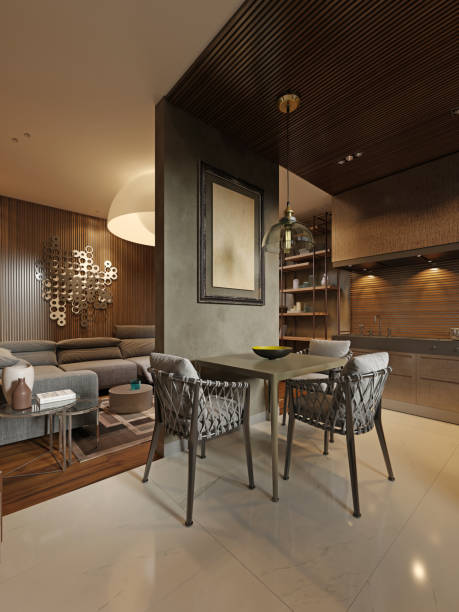 istock Dining room with contemporary style kitchen in dark brown studio apartments. Partition wall separating the living room and kitchen. 1249745499