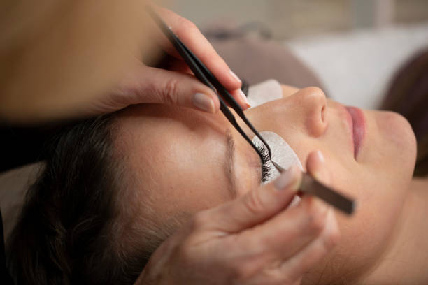 istock Close-up of the insertion of artificial eyelashes 1249745573