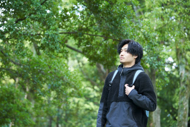 istock Young Japanese men enjoying hiking 1249745687