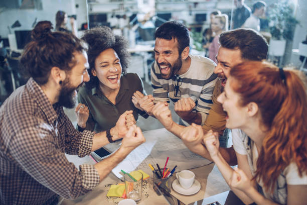 istock Celebrating success in the office! 1249750109
