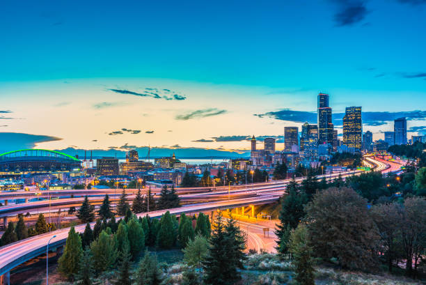 istock Seattle skylines and Interstate freeways converge with Elliott Bay and the waterfront background of in sunset time, Seattle, Washington State, USA. 1249752141