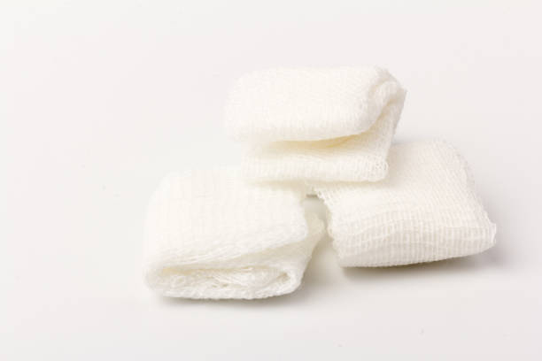 istock White gauze pads on white background. Materials for dental surgery. Close up 1249753089