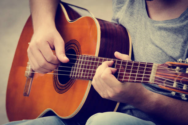 istock Man plays the guitar 1249753440
