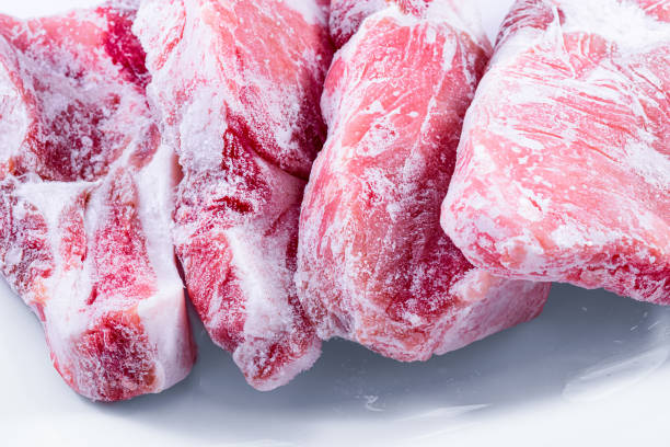 istock Raw frozen meat. raw pork chops 1249754508