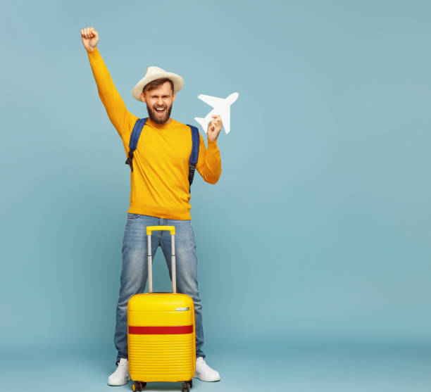 istock Happy male tourist with toy plane 1249755976