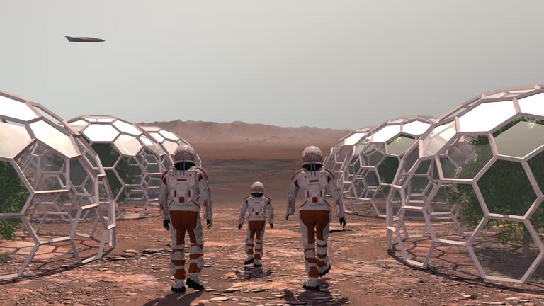 Family colonists immigrants to Mars, a man, a woman and a child admire the Martian landscape, the city and the spaceship. Exploring mission to mars. Elements of this video furnished by NASA.