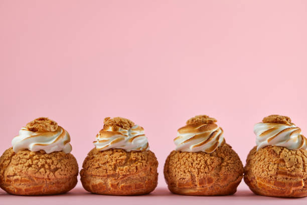istock Tasty cupcakes on pink background 1249757264