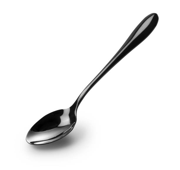 istock A black metal spoon on a white background 1249757749