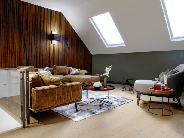 istock A modern attic with a living space, a sitting area with a large corner sofa and a fireplace, a working space with a desk, a lot of flowerpots with greenery. 1249758493