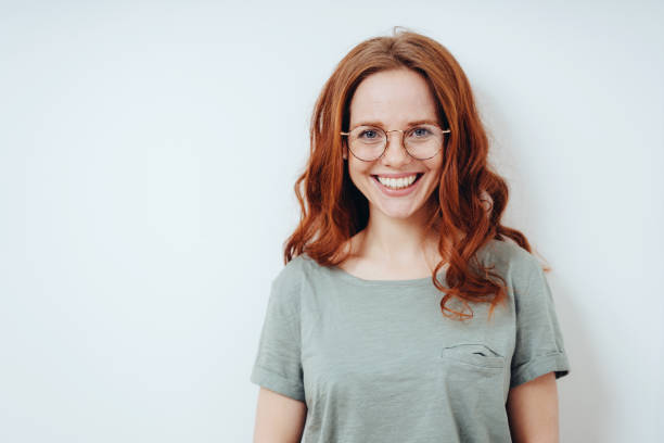 istock Happy vivacious young redhead woman 1249758618