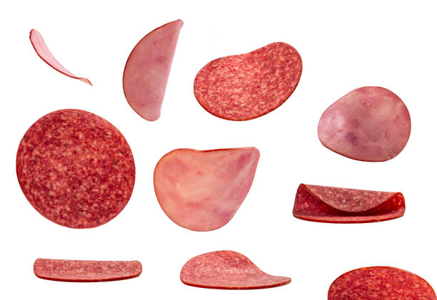 istock Falling tasty salami isolated on white 1249758770