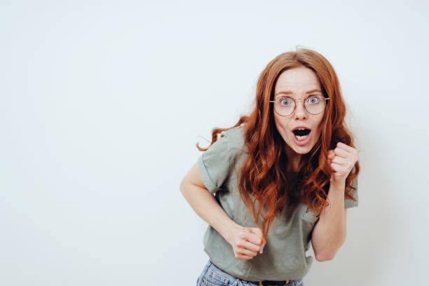 istock Motivated young woman cheering on the camera 1249758932