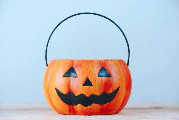 istock The empty pumpkin-shaped basket for children 's halloween party. 1249760530