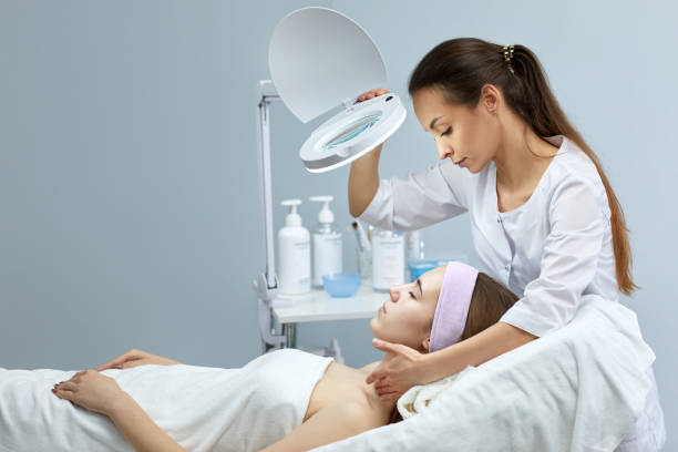 istock professional cosmetologist with patient in clinic 1249760915