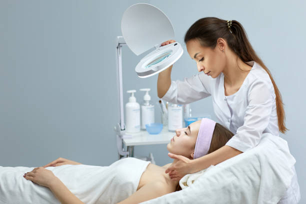 professional cosmetologist with patient in clinic professional cosmetologist with beautiful woman patient in clinic skin exame stock pictures, royalty-free photos & images