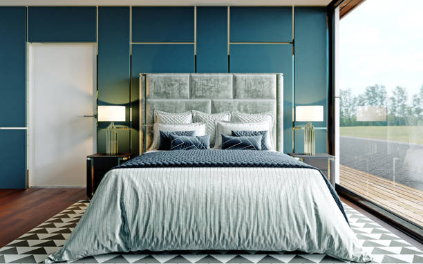 istock Designer bedroom in blue and white with brown parquet and a large panoramic window with a view. 1249762408