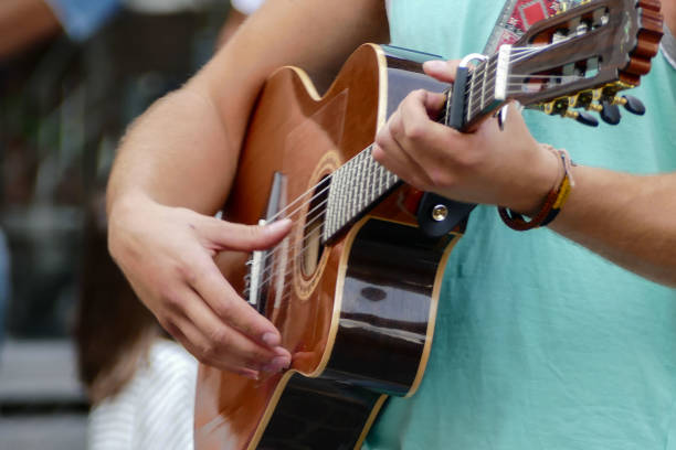 istock Person playing music outdoors 1249762564