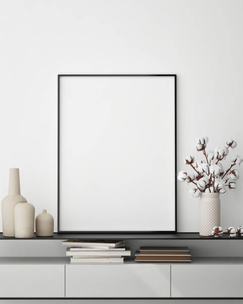 istock mock up poster frame in modern interior background, close up, living room, 3D render 1249763394