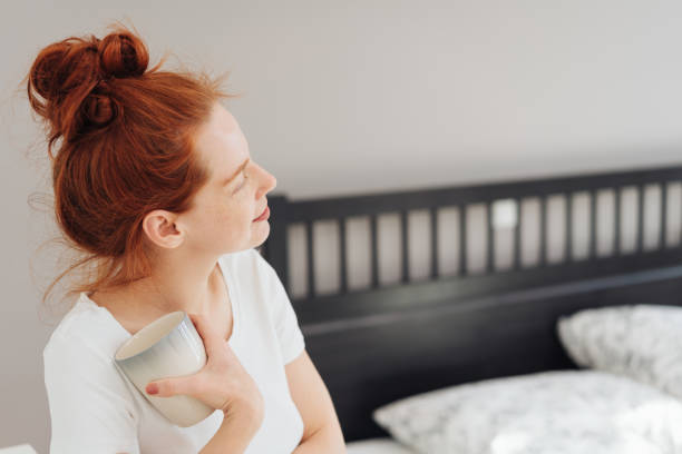 istock Thoughtful young redhead woman with mug of coffee 1249763532