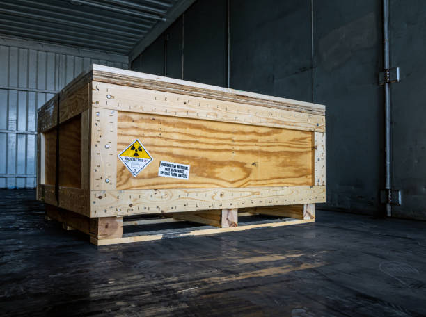 istock Radiation warning sign transport label Class 7 on the Dangerous goods package type A in the container of transport truck 1249764160