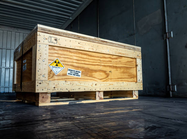 istock Radiation warning sign transport label Class 7 on the Dangerous goods package type A in the container of transport truck 1249764161