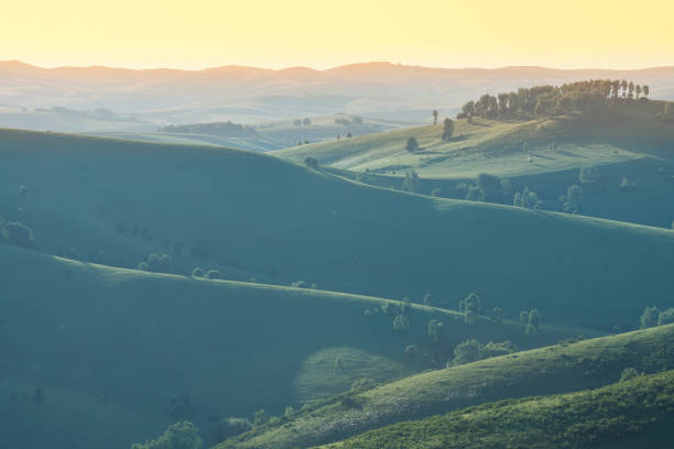 istock Green hills, meadows and mountain slopes in the evening light. Spring landscape. 1249765549