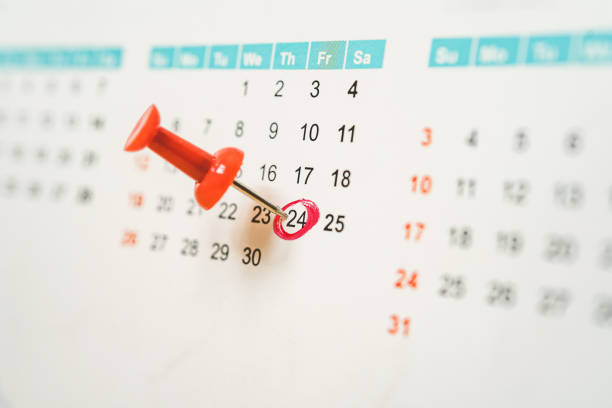 istock red push pin marked on 24th date on white calendar with red circle 1249766776