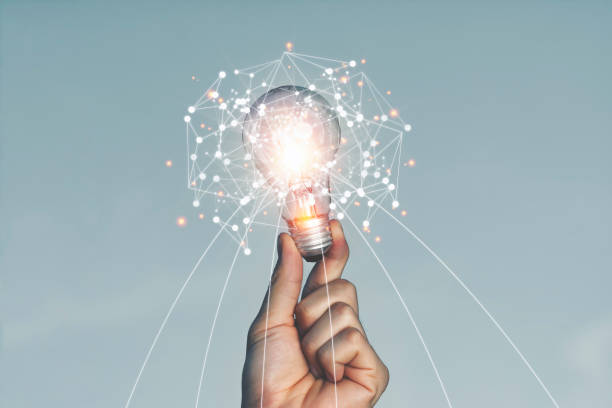istock A hand holding a light bulb Lifted up in the sky outdoors With new ideas 1249767949