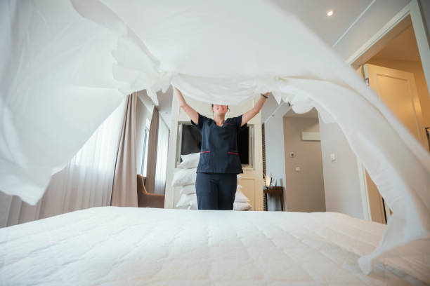 istock Maid doing the bed at hotel room 1249768166