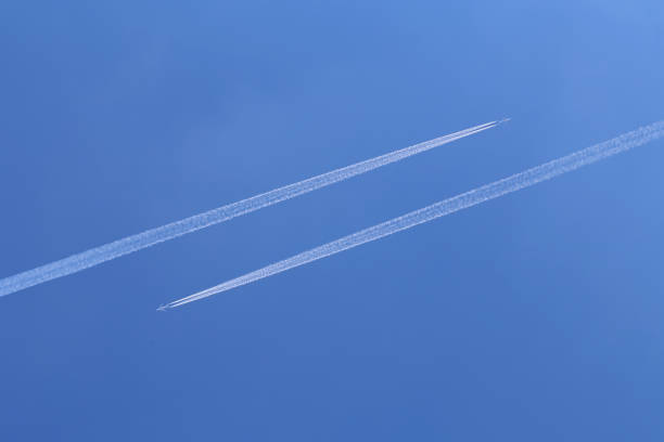 istock Trails from airplanes in the blue sky 1249769002